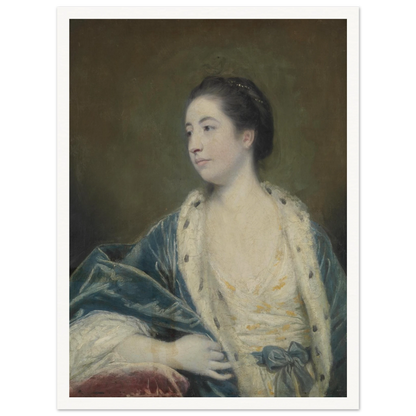 Young woman in a blue robe with fur trim poses against a dark green background