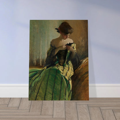 Woman in green and black evening gown pins a detail at her neckline against a muted background