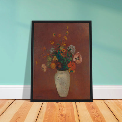 Flowers in a white vase against a red background with yellow and orange blooms