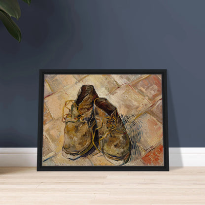 A pair of worn brown shoes with yellow laces rests on a pale tiled floor.
