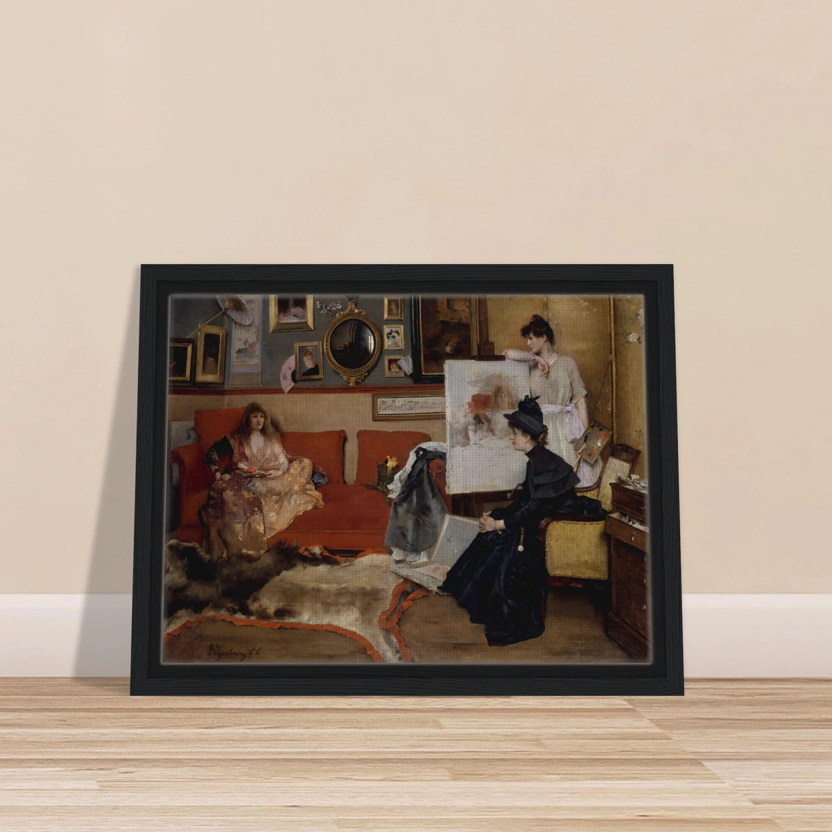 Three women gather in an artist’s studio with an easel, red sofa, framed pictures, and scattered art materials.