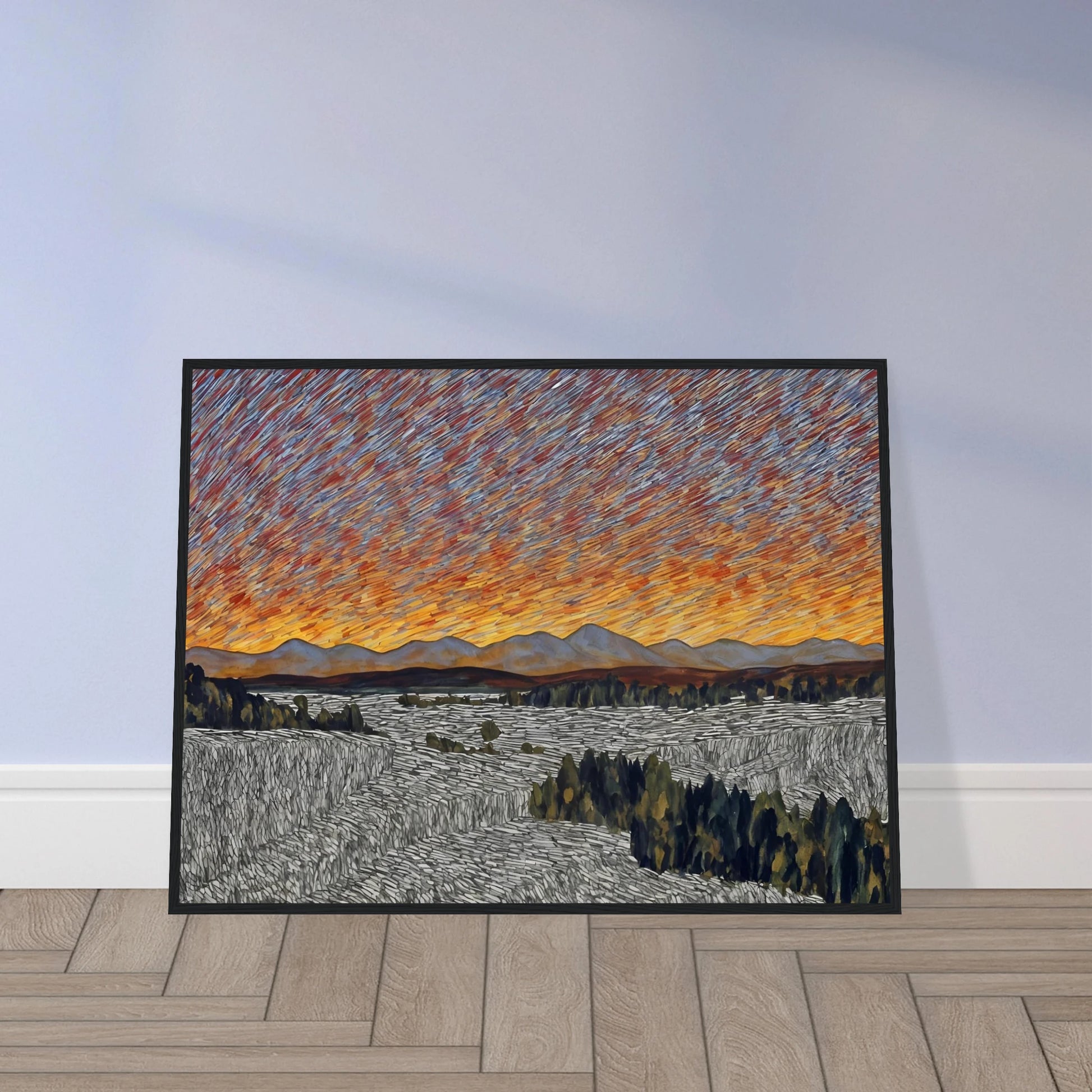 Vibrant orange sunset over distant mountains with textured sky and patterned fields in the foreground.