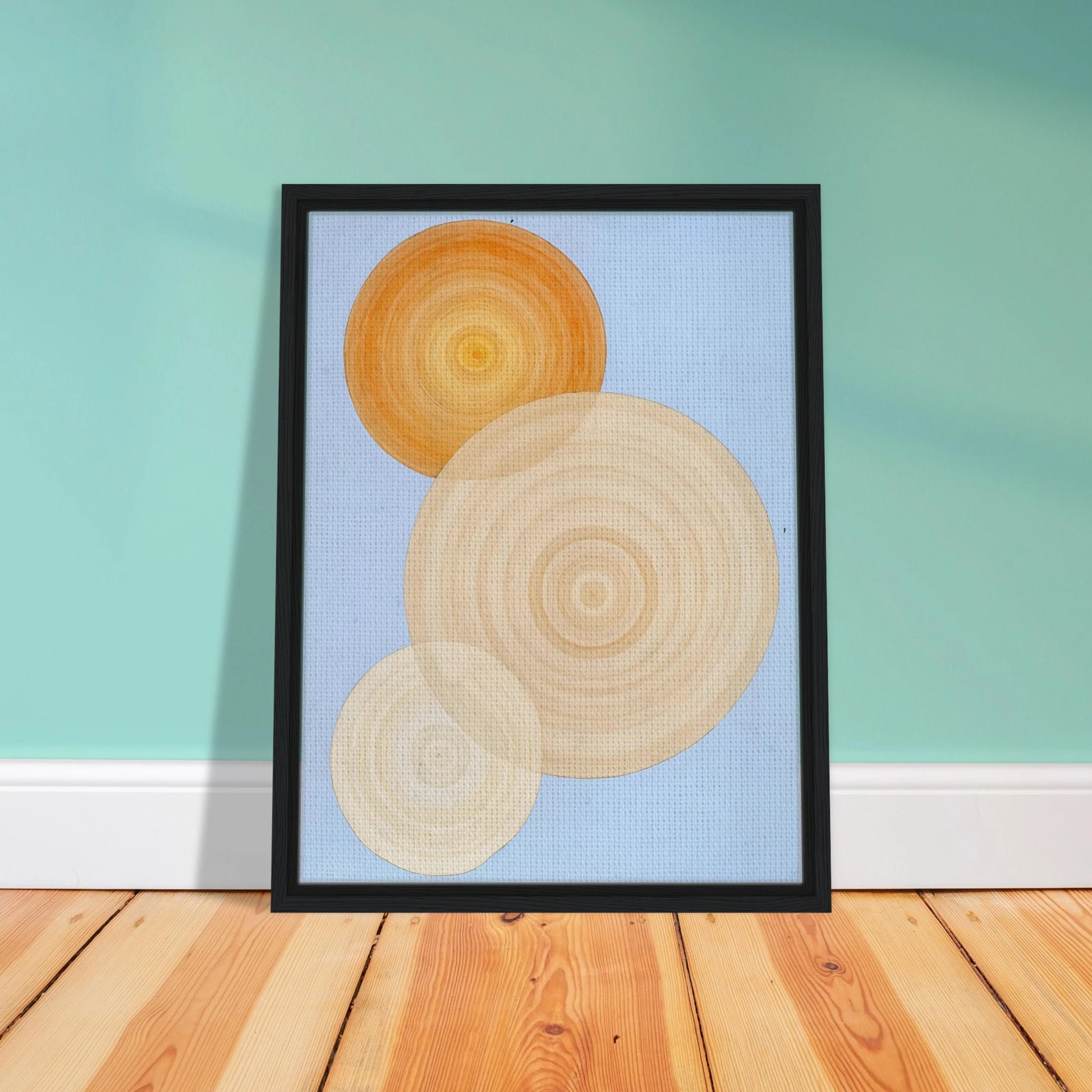 Three overlapping concentric circles in warm orange and beige tones float on a soft blue background like suns in serene orbit.