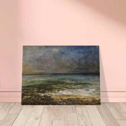 A calm sea under a moody sky, with soft waves rolling onto the shore, capturing the peaceful yet dynamic nature of the ocean.