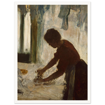 A woman leans over a table ironing white fabric, silhouetted against a softly lit laundry interior.