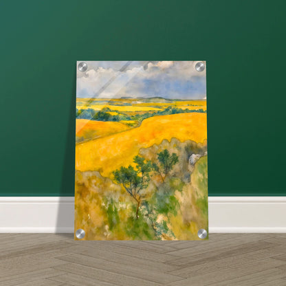 Golden fields stretch across rolling hills under a blue and cloudy sky, with trees dotting the lush summer landscape.