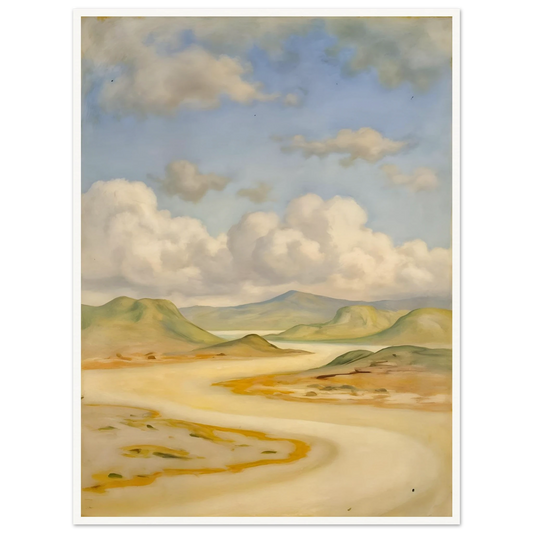 Soft clouds drift above pale hills, sandy curves, and quiet water under a blue sky.