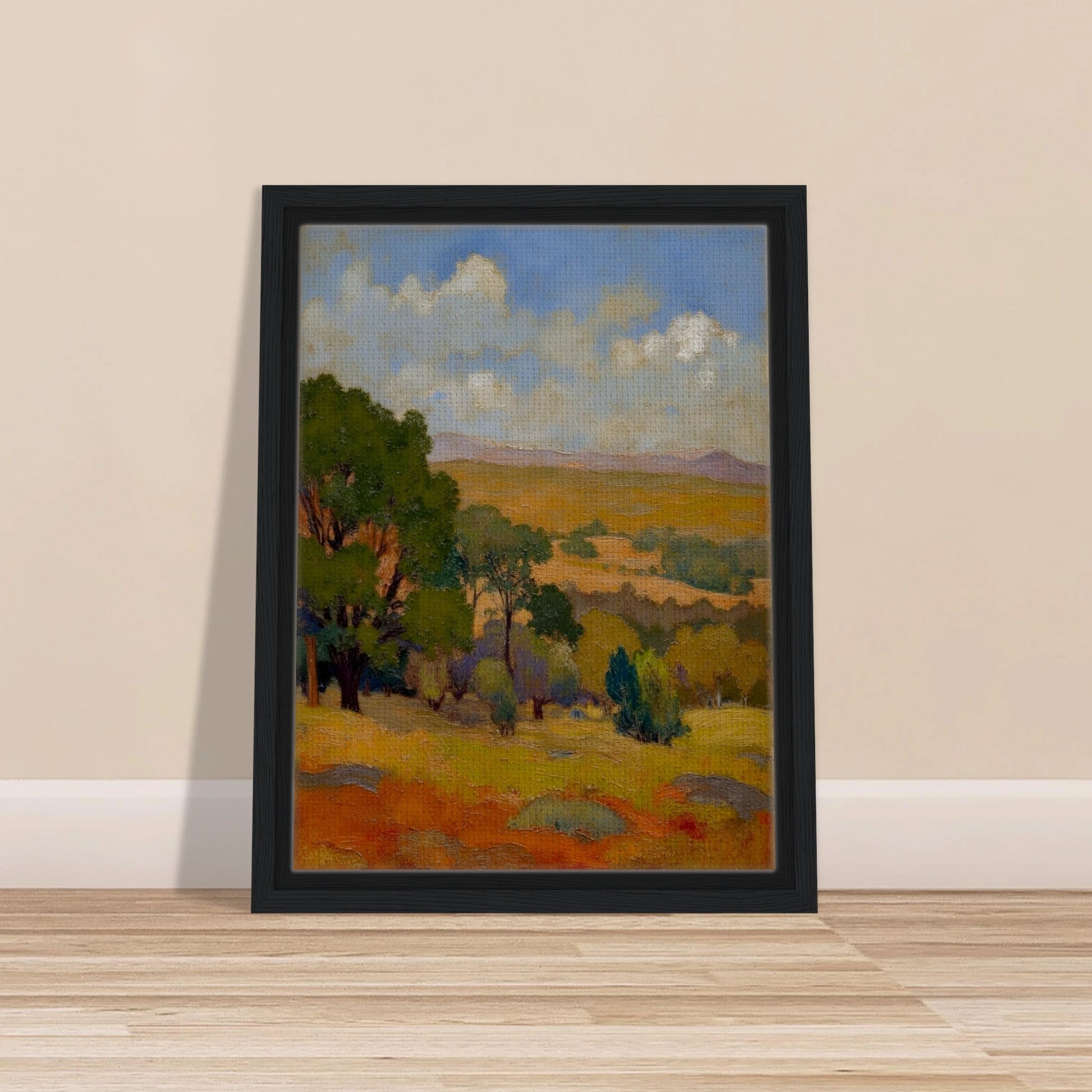 Golden fields and green trees stretch beneath a blue sky with soft clouds and distant hills.