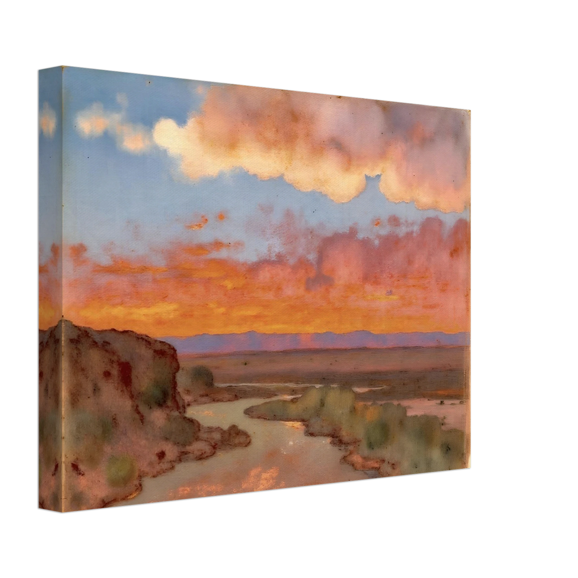 Soft desert river winding beneath glowing orange and pink sunset clouds, with distant plains and muted cliffs in a serene landscape.