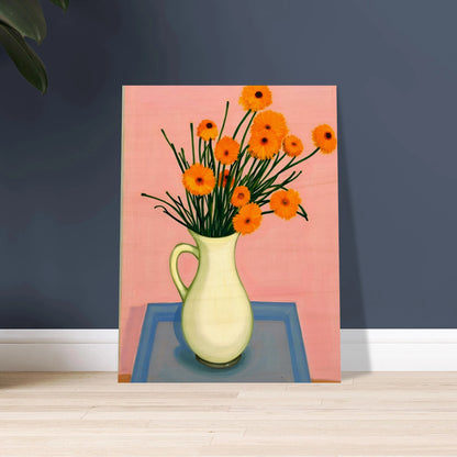 A vase of orange daisies with green stems against a soft pink background, radiating warmth and joy on a pastel tabletop.