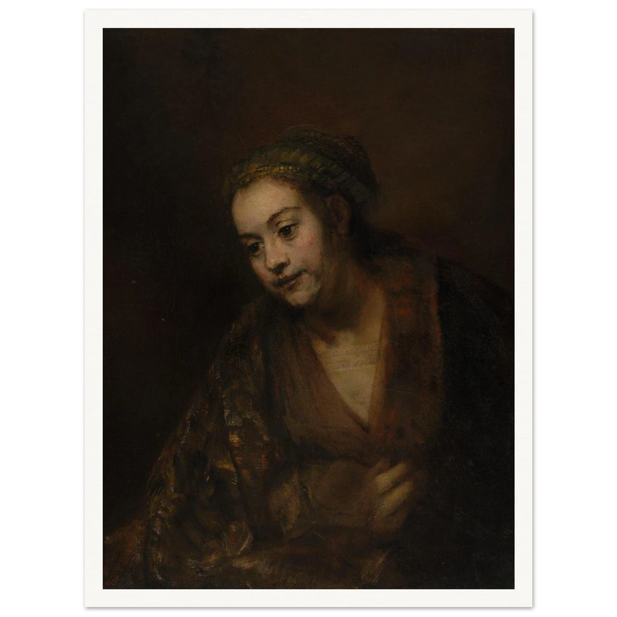 A softly lit woman looks downward while holding her robe against a dark brown background.