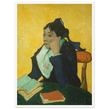 Woman in black and green sits at a table with open books against a vivid yellow background.