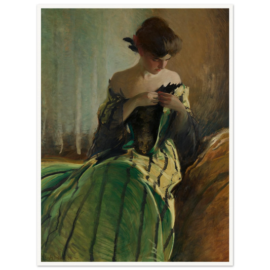 Woman in green and black evening gown pins a detail at her neckline against a muted background