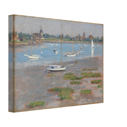 Sailboats rest at low tide near Riverside Yacht Club under hazy blue skies