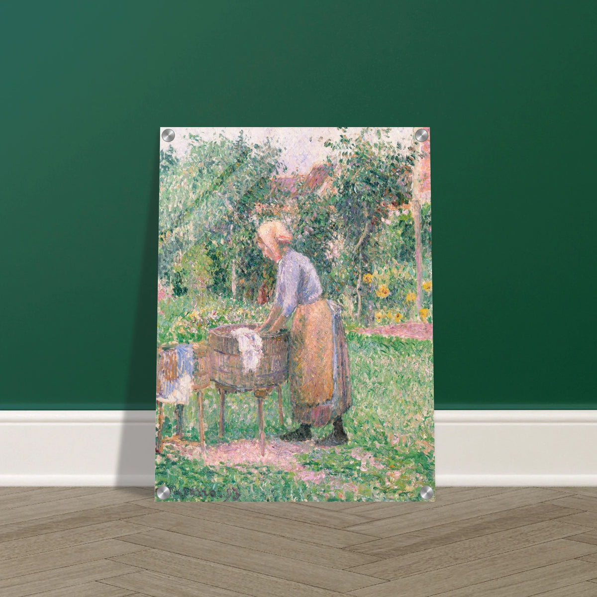 A Pointillist painting of a washerwoman hard at work, scrubbing linens and clothing in one barrel and rinsing them in another. 