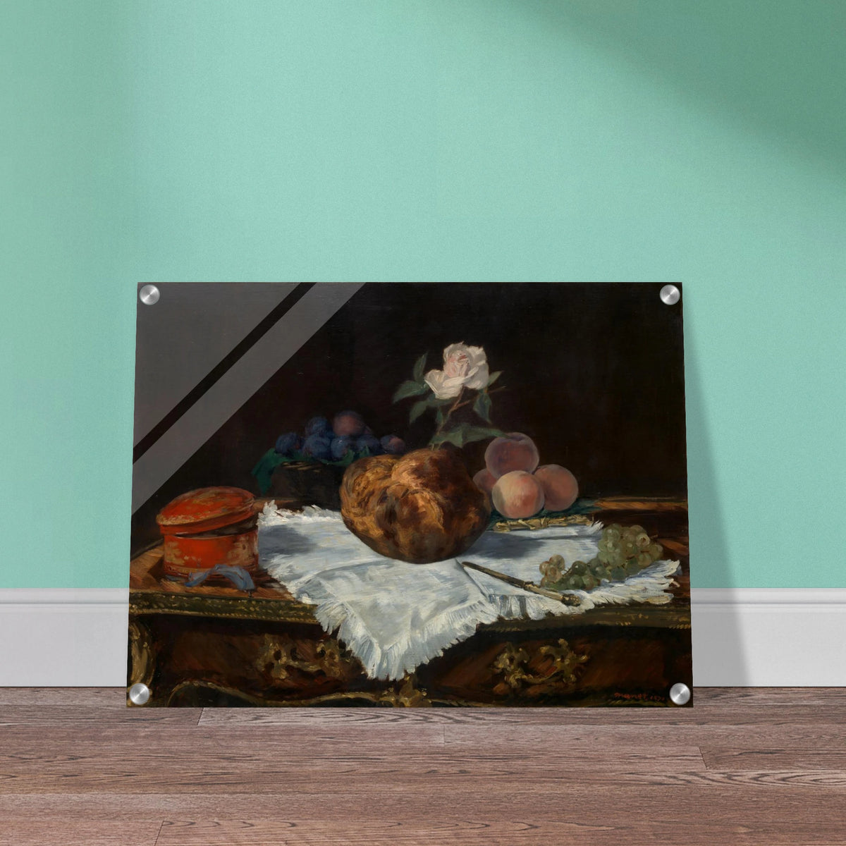 A brioche, fruit, white cloth, and tableware arranged in a quiet classical still life.