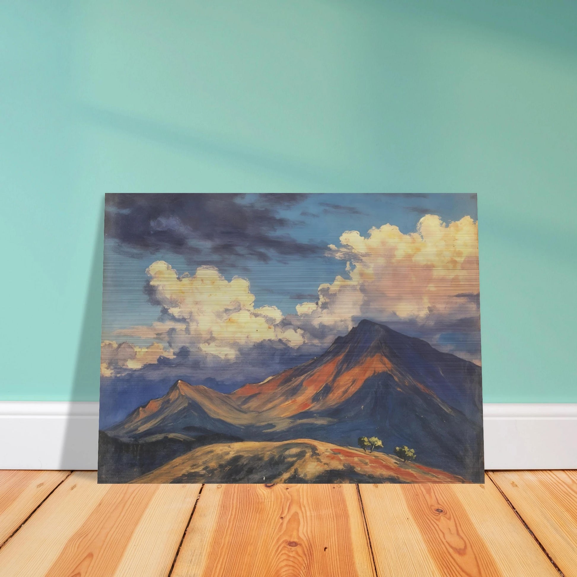 Sunlit mountain peaks glow beneath towering cream clouds and deep blue skies, with warm ridges stretching across an open landscape.