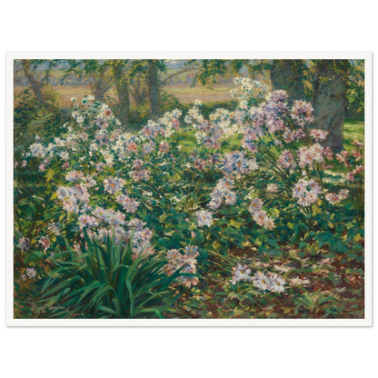 Pink and white flowers bloom densely among lush green foliage beneath tall trees in a sunlit garden.