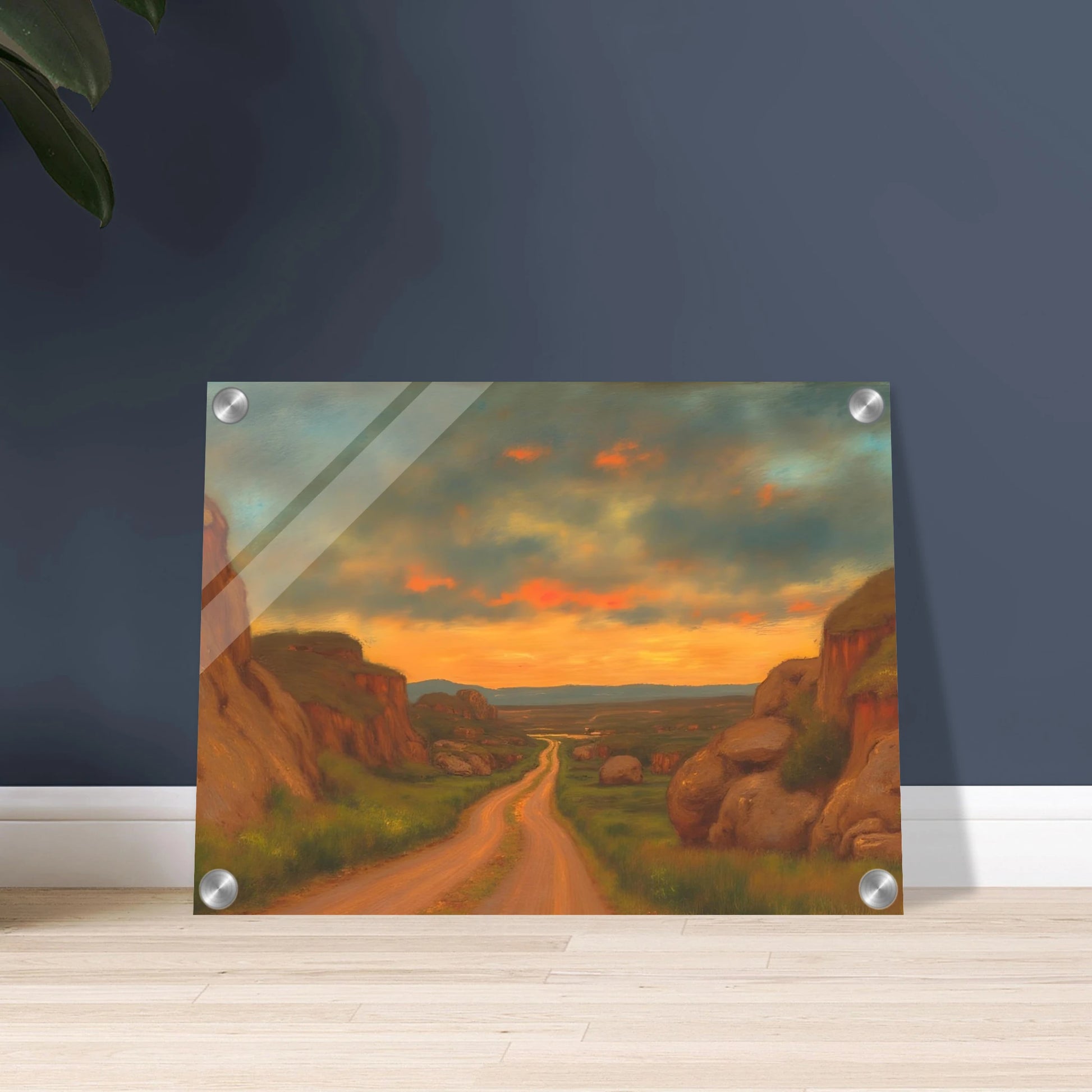 A winding dirt road cuts through rocky hills under a glowing sunset sky, evoking peace, wanderlust, and quiet reflection.