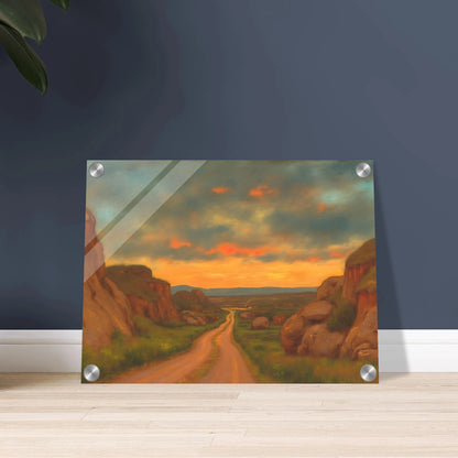 A winding dirt road cuts through rocky hills under a glowing sunset sky, evoking peace, wanderlust, and quiet reflection.