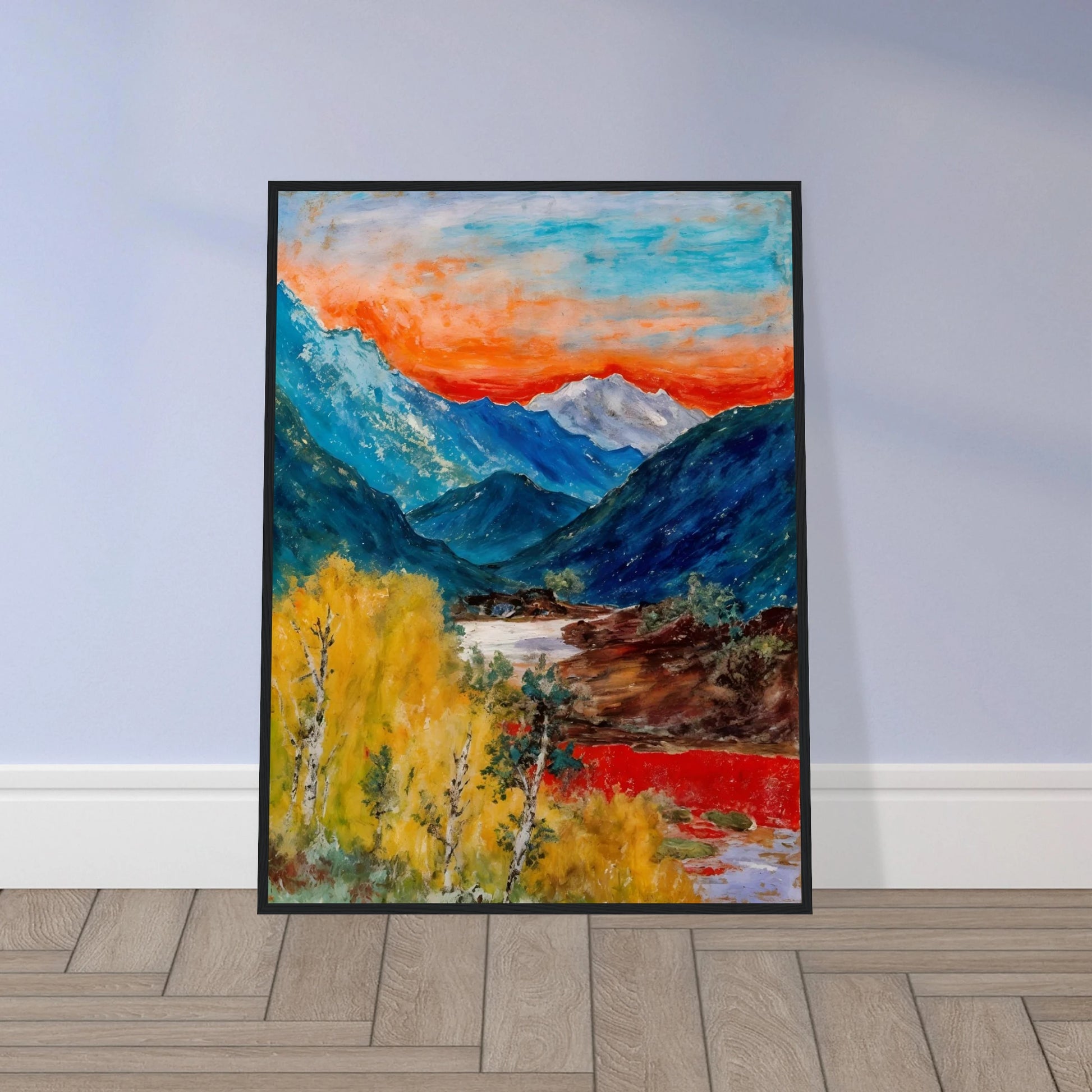 Snow-capped peaks rise above deep blue valleys and golden trees, beneath a fiery sunset glowing across the horizon.
