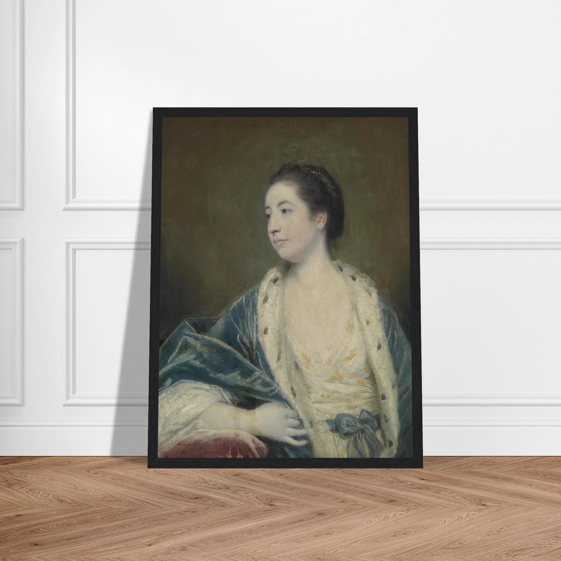 Young woman in a blue robe with fur trim poses against a dark green background