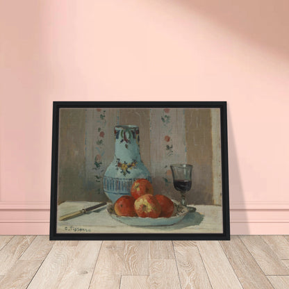 Apples on a plate with a blue pitcher, wine glass, and knife before floral wallpaper.
