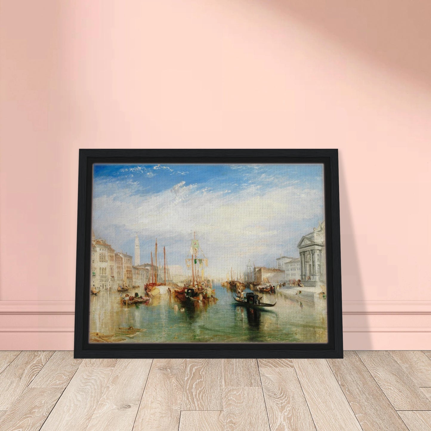 Gondolas and sailing boats fill Venice’s Grand Canal beneath a bright blue sky and luminous clouds.
