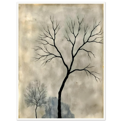Two leafless trees stand silhouetted against a misty gray sky, evoking a quiet, contemplative atmosphere.