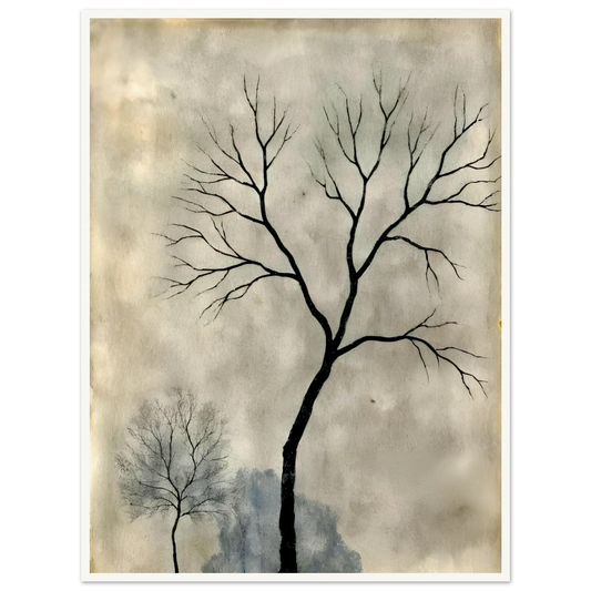 Two leafless trees stand silhouetted against a misty gray sky, evoking a quiet, contemplative atmosphere.