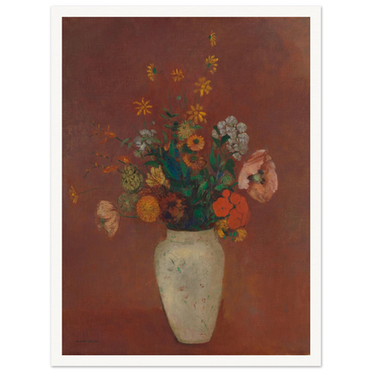 Flowers in a white vase against a red background with yellow and orange blooms