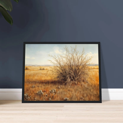 A golden-brown field stretches into the distance under a pale blue sky, with a single dry bush standing in quiet solitude.
