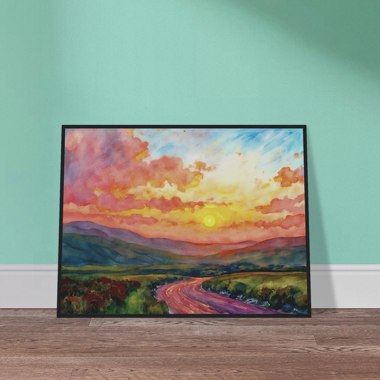 Vibrant watercolor landscape of a winding road through rolling hills beneath a glowing sunset sky filled with pink, gold, and blue clouds.