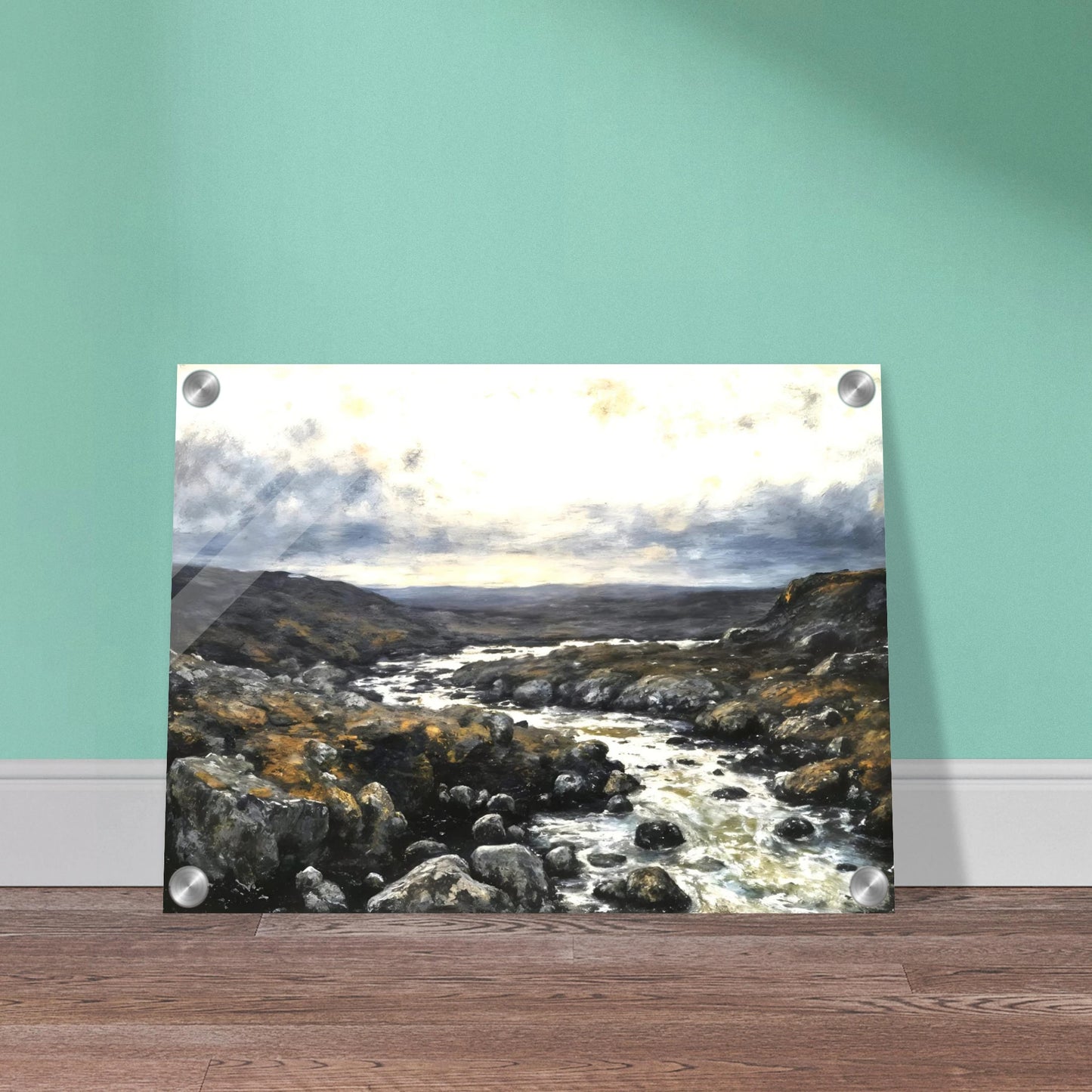 A rugged river winds through rocky highlands beneath dramatic clouds, blending silver waters with earthy terrain and distant horizons.
