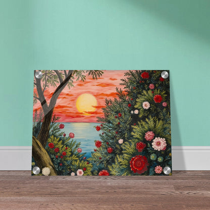 A vivid sunset over the ocean framed by lush bushes filled with red, pink, and white flowers.