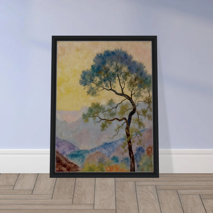 Delicate tree with green-blue foliage standing before pastel mountains under a soft yellow dawn sky.