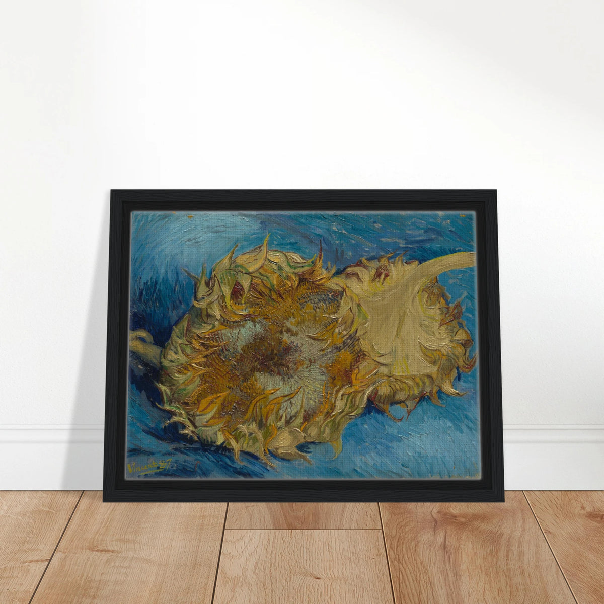 Two cut sunflowers lie on a vivid blue background with thick, expressive brushstrokes.