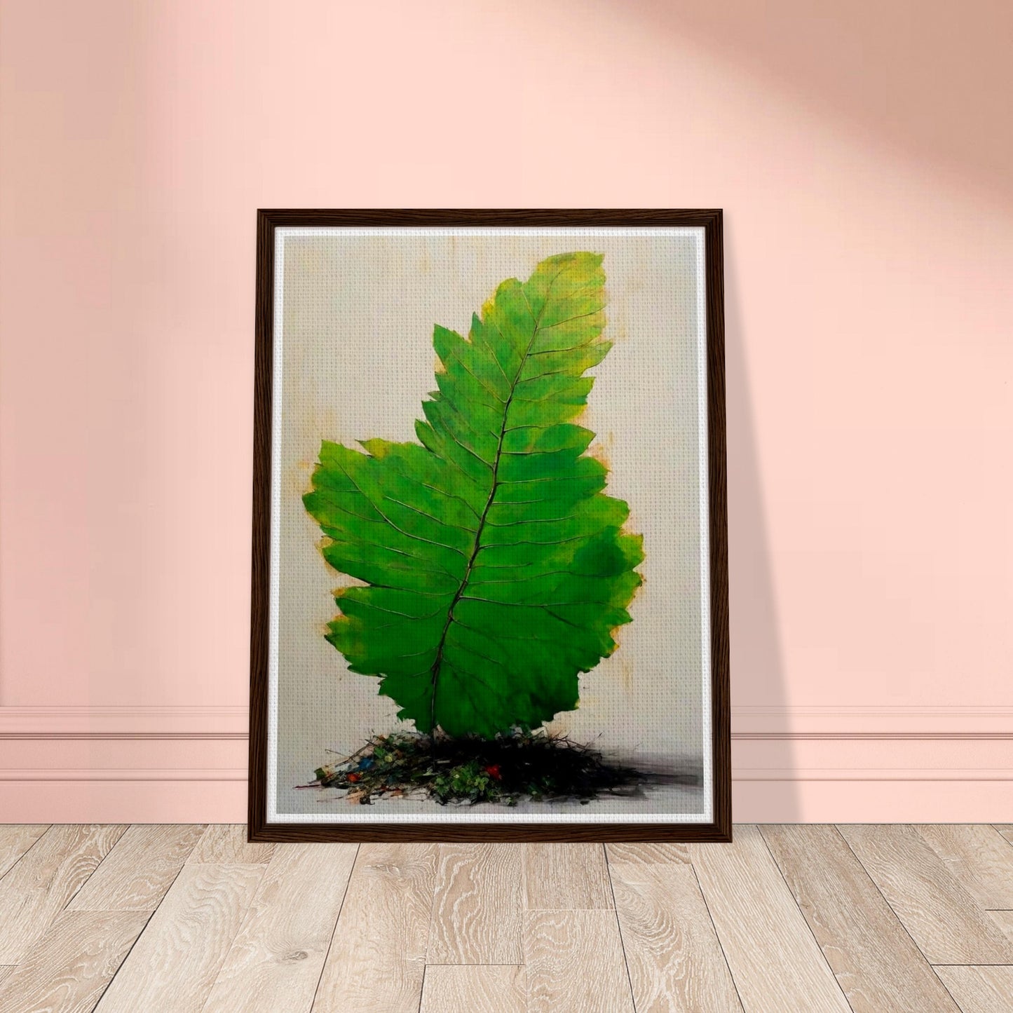 A large, vivid green leaf standing upright against a light background, with intricate veins and subtle texture, emerging from a small mound of organic debris.