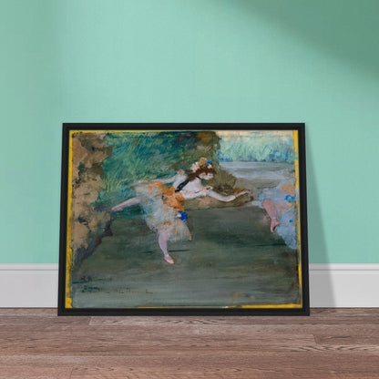 A ballet dancer in a pale tutu performs onstage, with another dancer partly visible at the side.