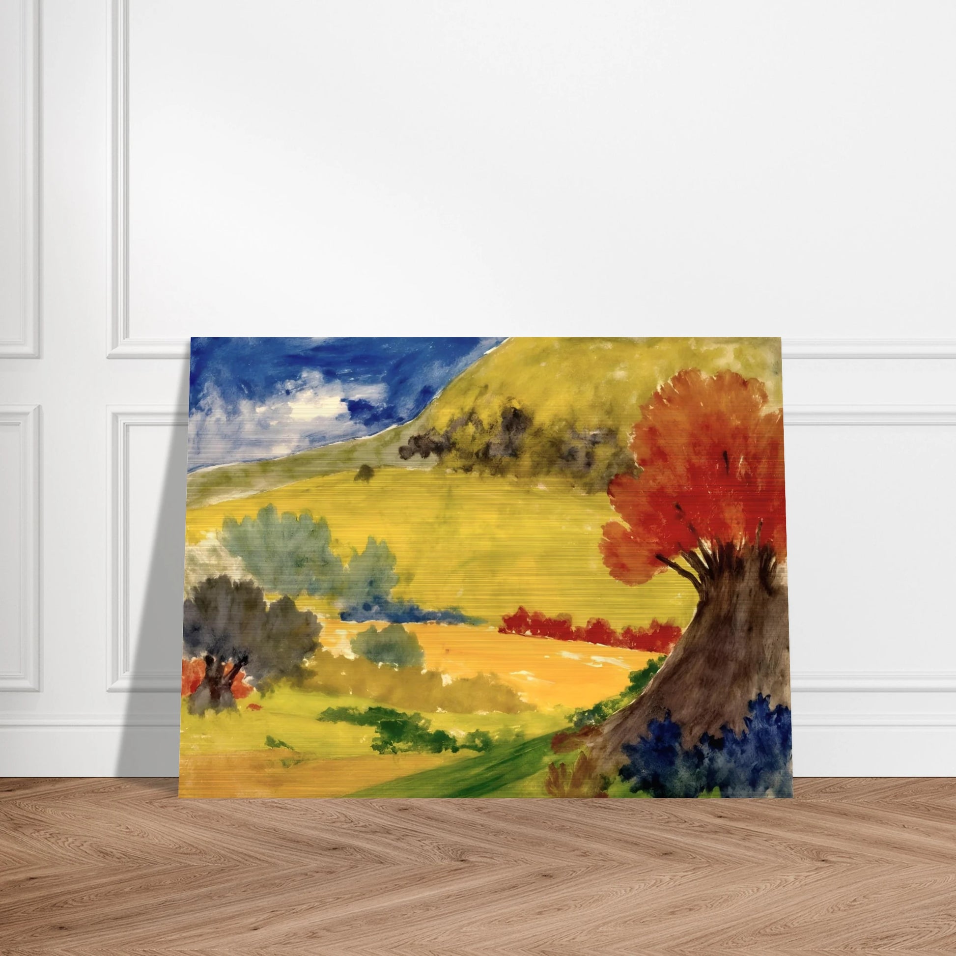 Red tree rises beside golden hills, green fields, and a deep blue sky in a bright countryside scene.