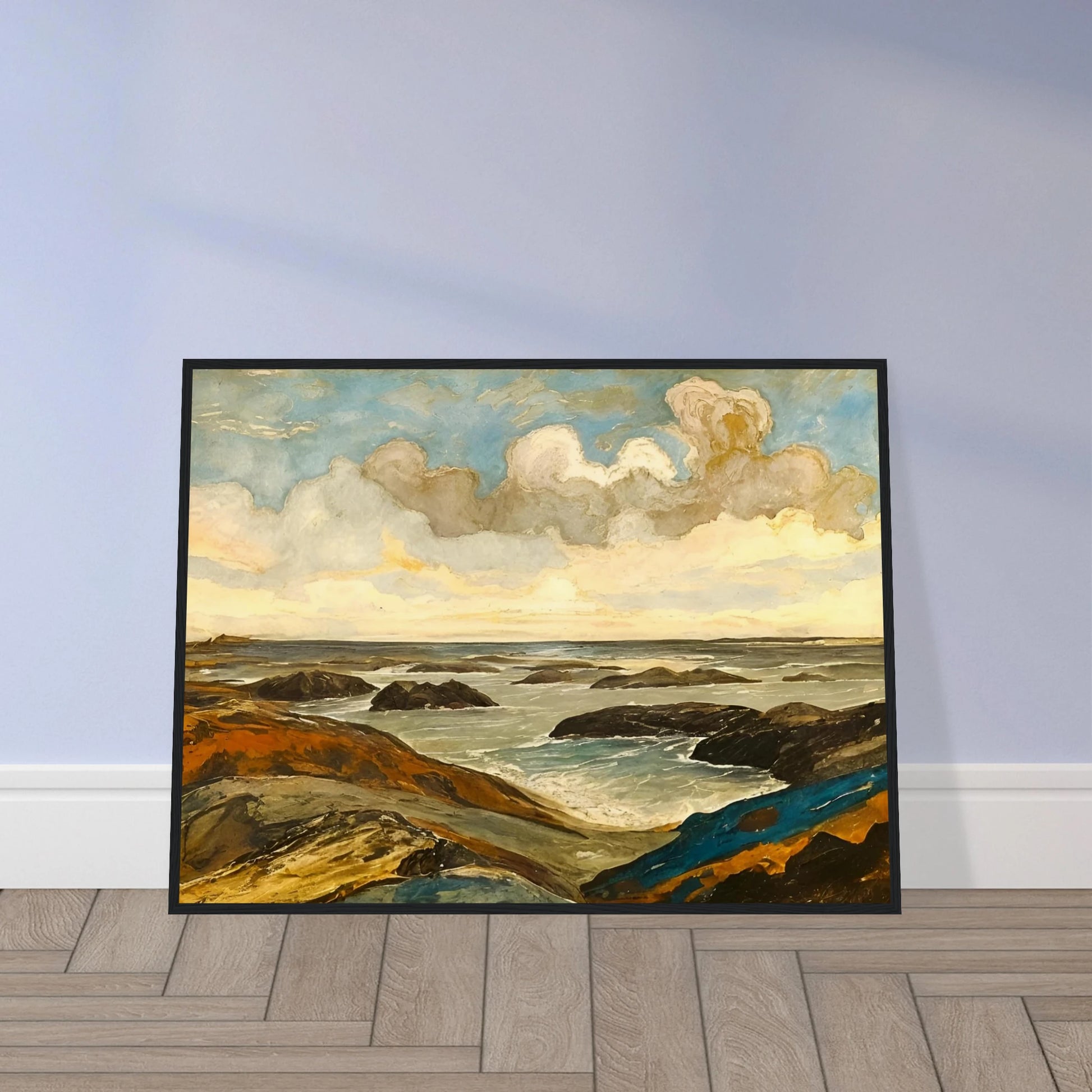 Rocky seashore with dark stones and rolling waves beneath a dramatic sky of shifting clouds and golden sunlight.
