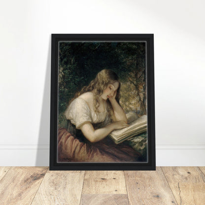 A young girl sits outdoors reading a large open book in a shaded woodland setting.