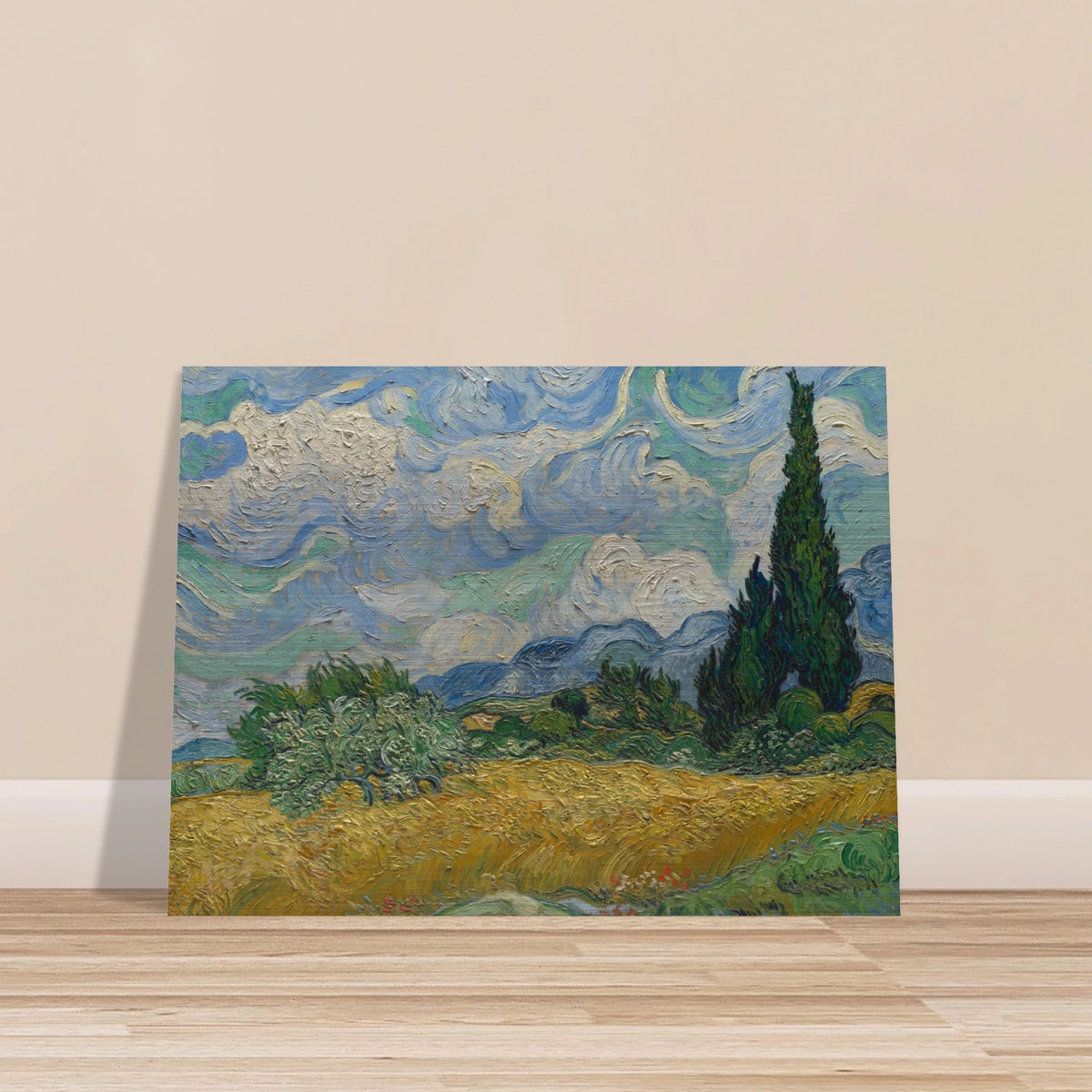 Golden wheat field and dark cypress trees beneath swirling blue-and-white clouds in a vivid Provençal landscape.
