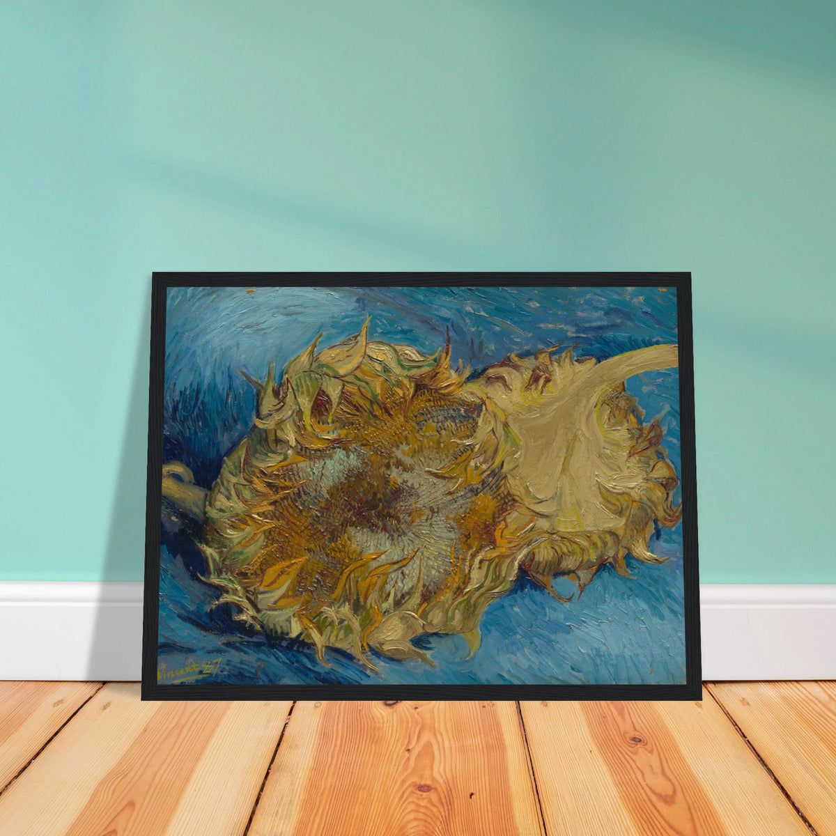 Two cut sunflowers lie on a vivid blue background with thick, expressive brushstrokes.