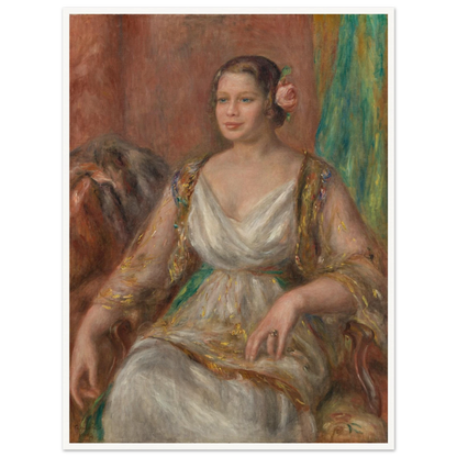 A seated woman in a soft white dress with a pink rose in her hair rests against a warm interior.
