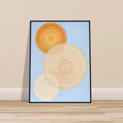 Three overlapping concentric circles in warm orange and beige tones float on a soft blue background like suns in serene orbit.
