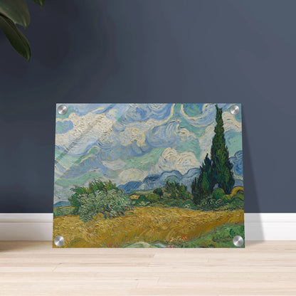 Golden wheat field and dark cypress trees beneath swirling blue-and-white clouds in a vivid Provençal landscape.