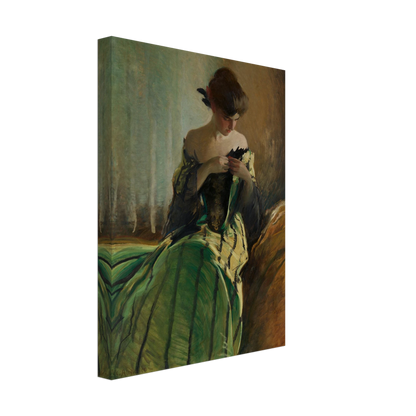 Woman in green and black evening gown pins a detail at her neckline against a muted background