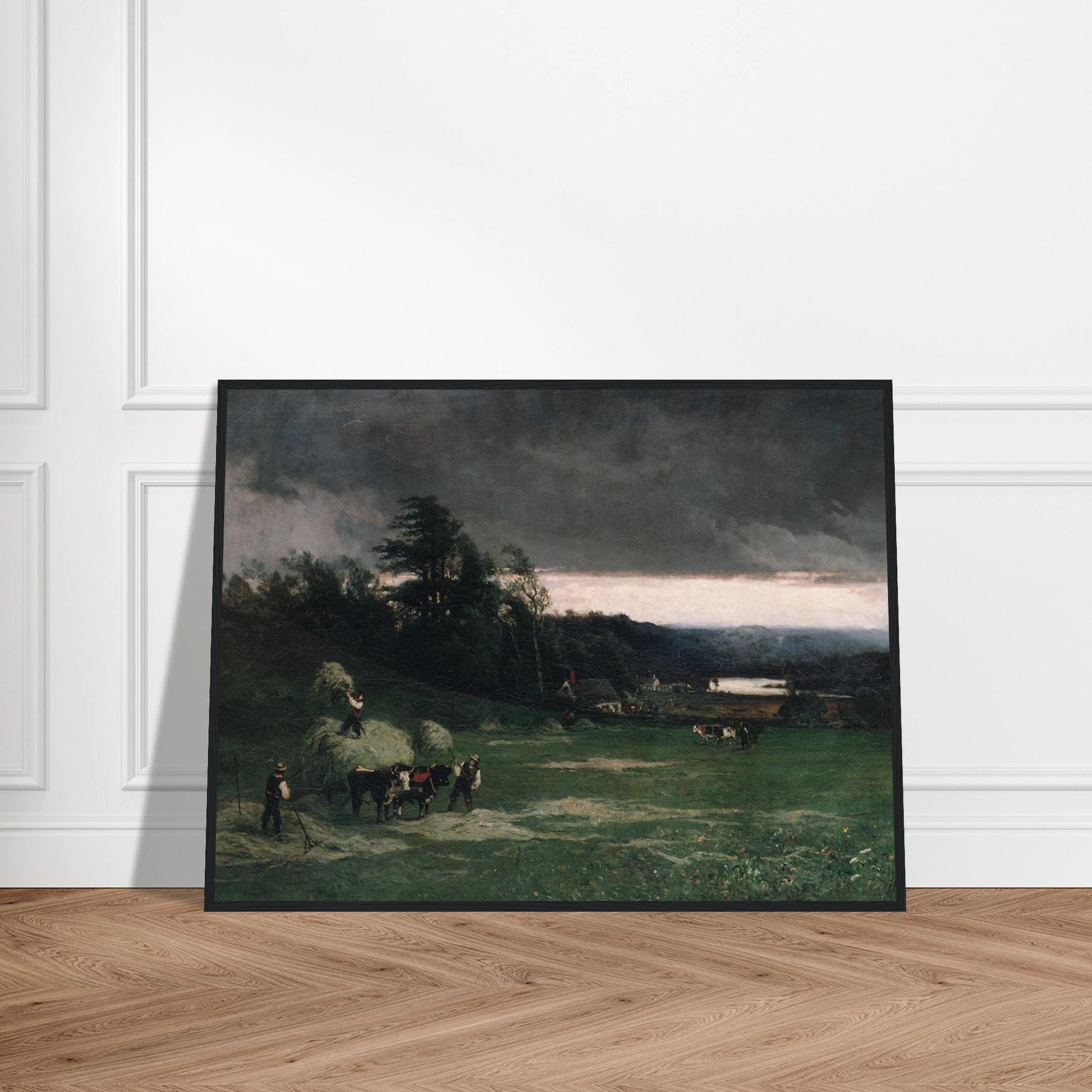 Workers gather hay in a green field under dark storm clouds