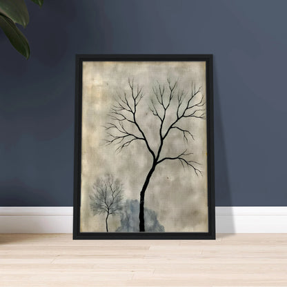 Two leafless trees stand silhouetted against a misty gray sky, evoking a quiet, contemplative atmosphere.